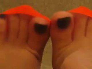 Feet In Orange Stockings View...