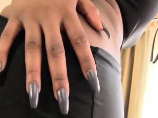Stripteasing black shemale strokes her cock