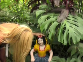 Attractive blonde shemale strips outdoors and shows huge ass