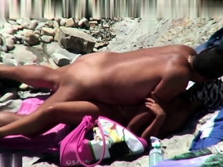 Nude amateur couple filmed at beach...