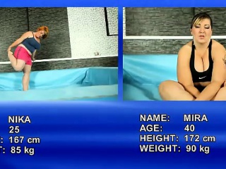 Nude wrestling match between 2 fat and big-titted women