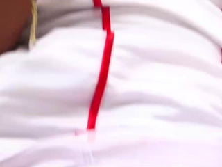 Blonde Asian shemale in sexy nurse uniform plays with her