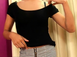 Tanned ladyboy in tight grey pants strips and jerks off