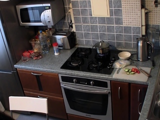 Filming nude girlfriend cooking within the kitchen