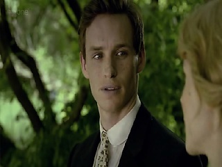 Clemence Poesy mendacity on her again in mattress as a man kisses her