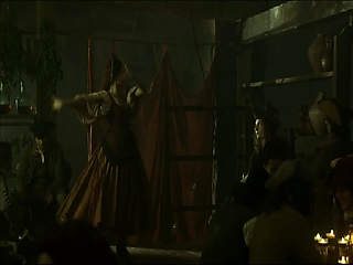 Natalie Portman mendacity bare on her facet on some hay on the