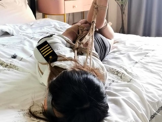 chinese hogtie on bed
