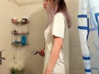Two Girls Wearing Wet Shirts In The Shower