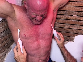 Stand up Dev tries resisting tickling while bondaged