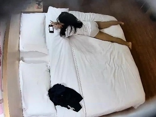 Cute amateur asian web cam girl playing with her toy