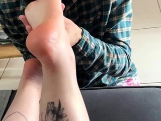 Brunette with foot fetish rubs big dick with her feet in POV