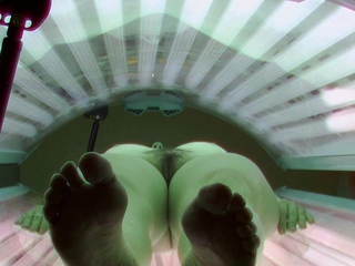 Hairy brunette in solarium