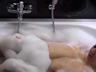 Busty curly brunette with big boobs fucks on couch