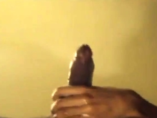 Black guy jacks off his big cock and cums hard
