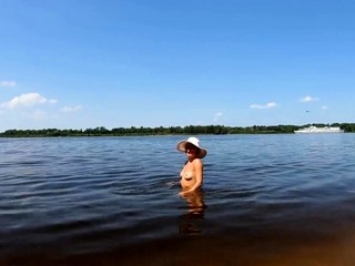 Blonde Solo Nudist Shows Off Tattoos by the River
