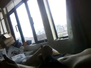 Two frat boys stroke each other’s big cocks